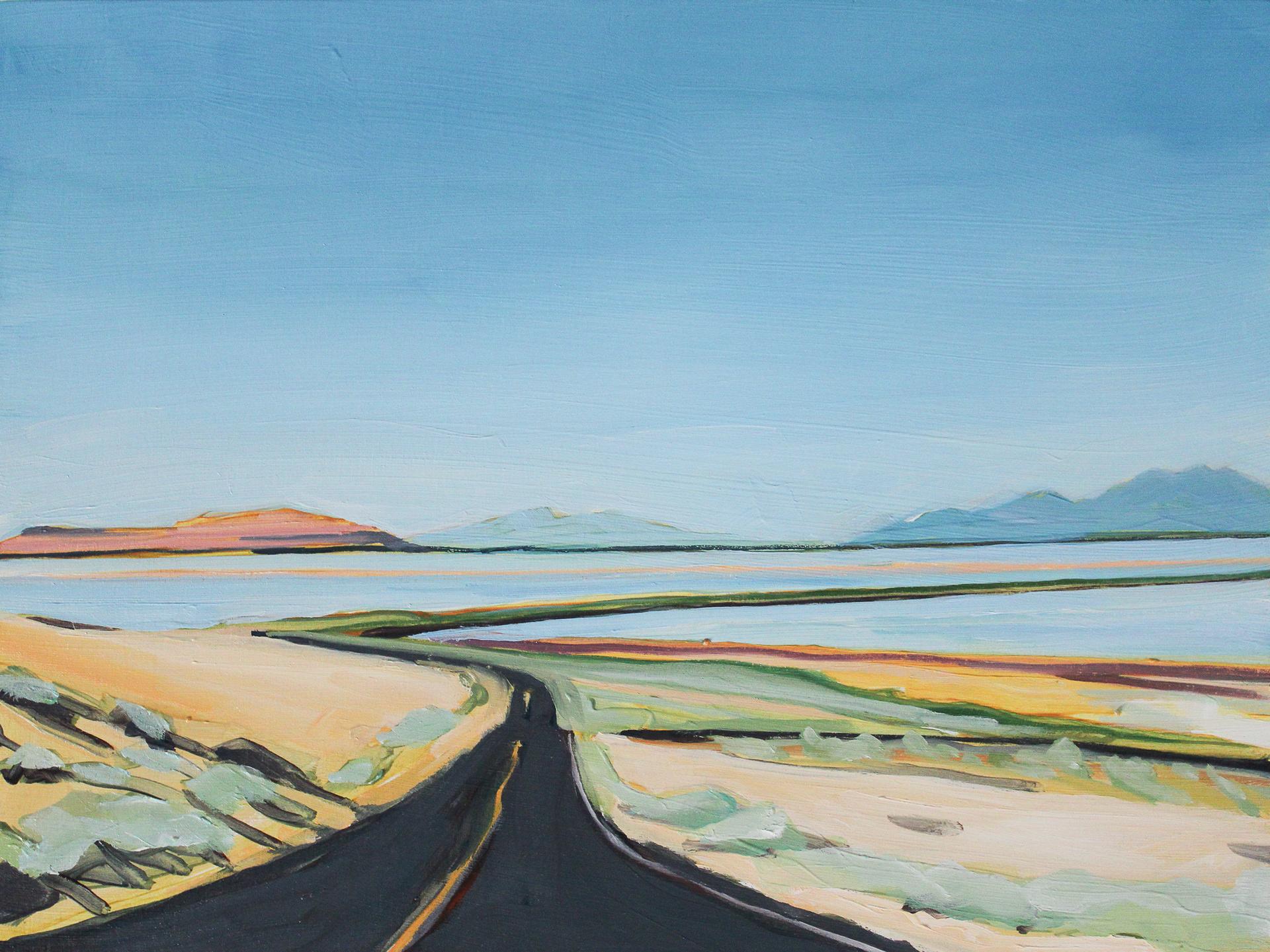 road extending into distance a bridge over water mountains far away